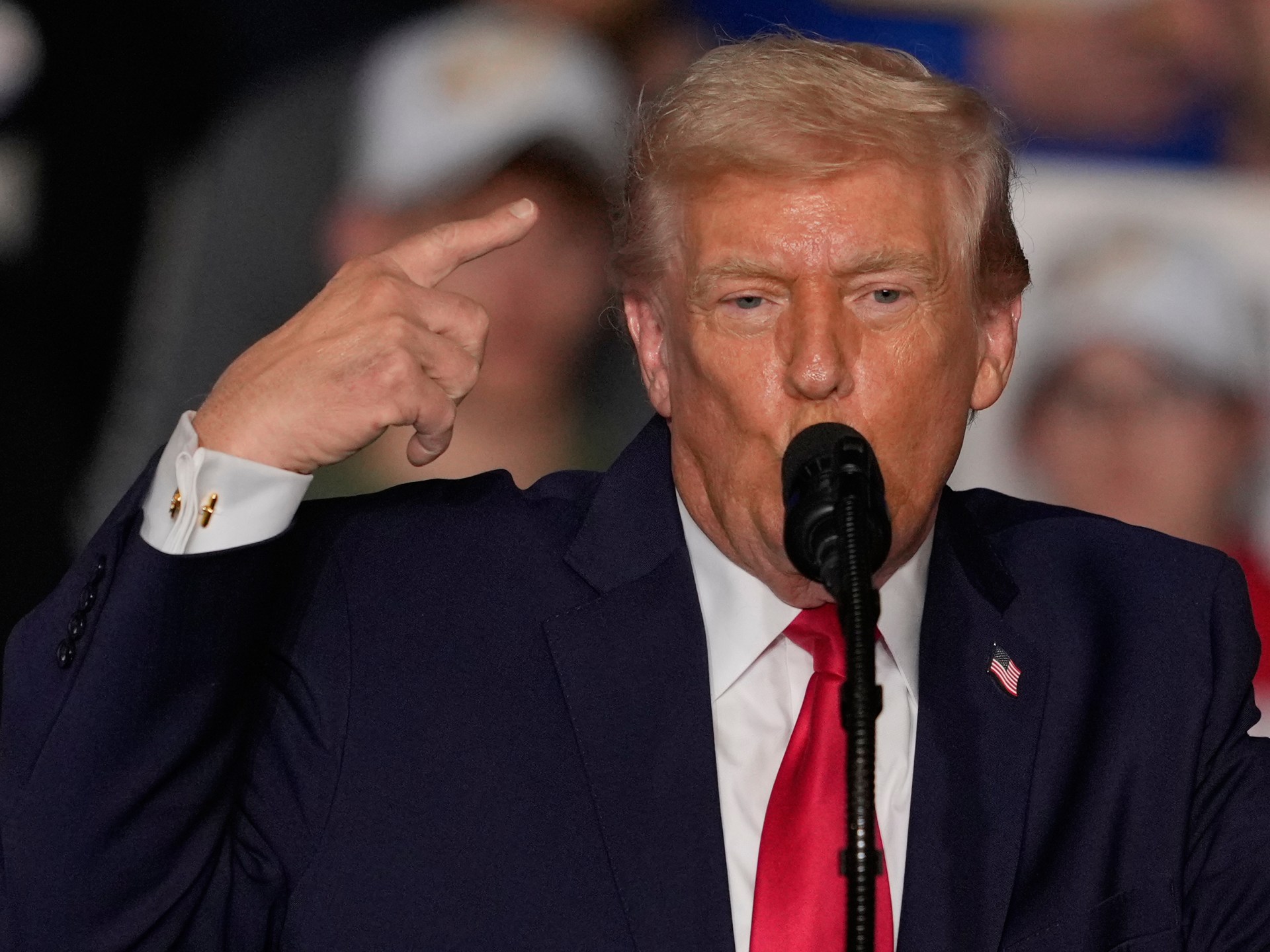 Trump Touts Economic Gains Amid Immigration Crisis Fallout